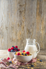 Healthy Corn Flakes for Breakfast with Milk and fresh summer berries