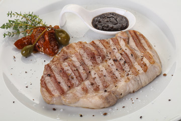Grilled pork steak with pepper sauce