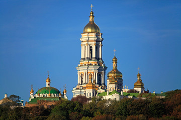 Fototapeta na wymiar Kiev Pechersk (Kyiv Pechersk) Lavra monastery and it’s bell tower (Great Belfry). Historical and cultural reserve – UNESCO object 