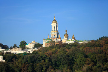 Fototapeta na wymiar Kiev Pechersk (Kyiv Pechersk) Lavra monastery and it’s bell tower (Great Belfry). Historical and cultural reserve – UNESCO object 