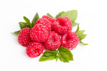 Raspberry with leaves isolated on white background