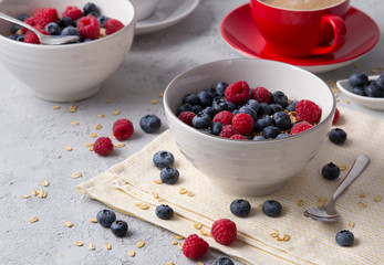 Healthy breakfast with oatmeal, coffee and berries.