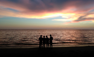 Fototapeta na wymiar evening sky view in varakkal beach kozhikode four friends wallpaper