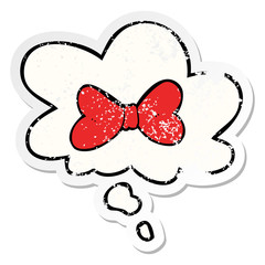 cartoon bow tie and thought bubble as a distressed worn sticker