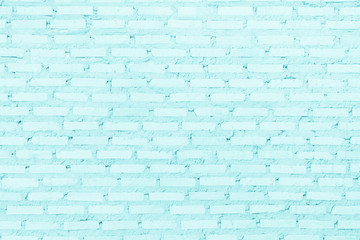 Brick wall painted with pale blue paint pastel calm tone texture background. Brickwork and stonework flooring interior.