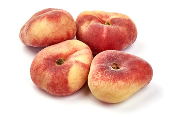 Flat Peaches, ripe nectarines, close-up, isolated on white background