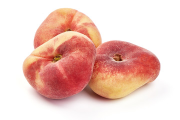 Flat Peaches, ripe nectarines, close-up, isolated on white background