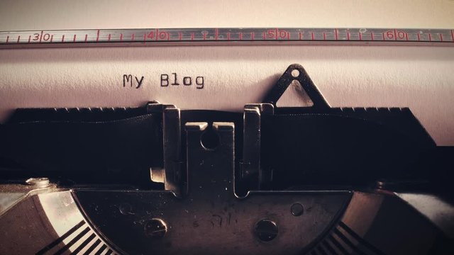 old typewriter with text my blog being typed