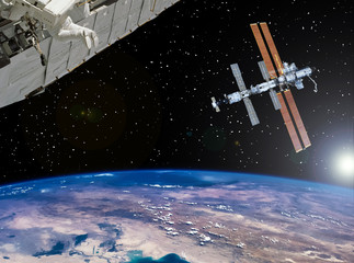 Space station and spaceship above the earth. The elements of this image furnished by NASA.