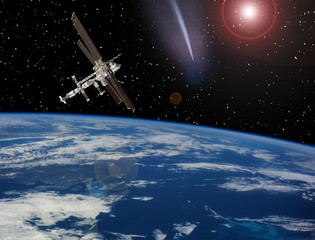 Space station above the earth. Meteors, comets in space. The elements of this image furnished by...