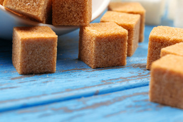 White refined sugar and brown unrefined sugar cubes