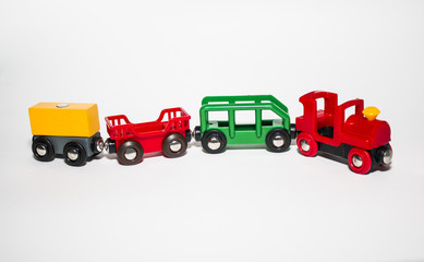 colorful children's wooden train rides on the railway