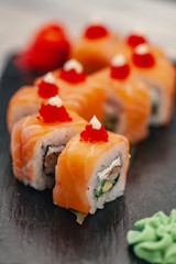Healthy food. Japanese restaurant. Sushi roll on a black background