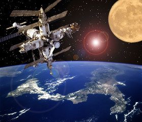 Spaceship and moon. Earth on the backdrop. The elements of this image furnished by NASA.