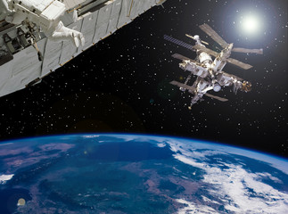 Space station and spaceship above the earth. The elements of this image furnished by NASA.