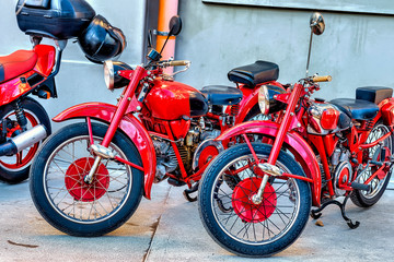 detail of red two old motorbike