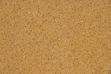 Yellow granite wall with quarts and smooth surface as background