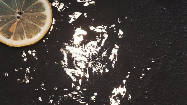 lemon slice on dark background close up