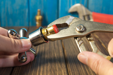 Work combines elements of plumbing with the help of tools.