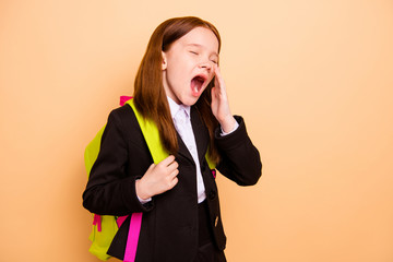Portrait of nice attractive lovely tired bored hard-working pre-teen girl learner wearing jacket...