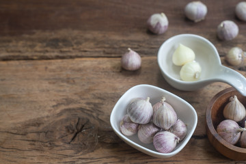 Top view of herbal vegetable ingredients, fresh garlic, on old wooden table, cooking preparation concept