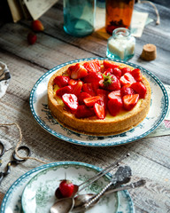 Homemade delicious strawberry tart or pie with sweet berries on top