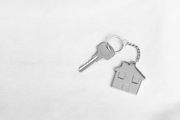 House key with home keyring in on white background