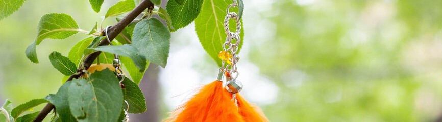 Banner of earrings of handmade dream catcher with feathers threads and beads rope hanging
