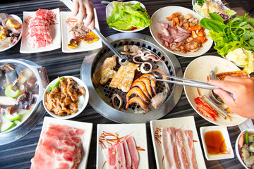 people eating barbecue beef in restaurant