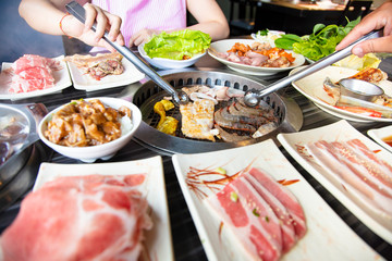 people eating barbecue beef in restaurant