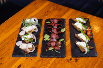beer snacks on a dark rectangular stand