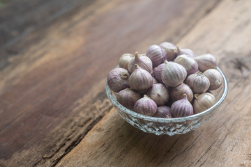 Top view of herbal vegetable ingredients, fresh garlic, on old wooden table, cooking preparation concept