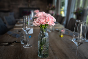 Flower decoration at the wedding. Wedding bouquet of bride and witness. Golden wedding rings on the flowers