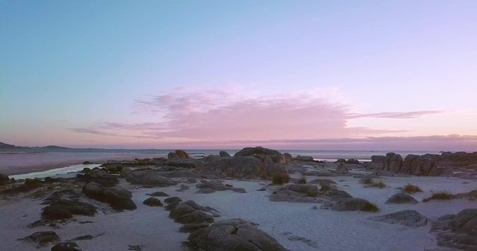 Sunset at a stunning Galician beach with a river estuary and a forest nearby n1