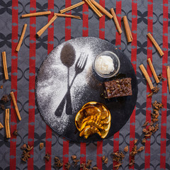 sweet dessert with ice cream, piece of cake and orange