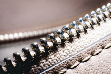 Close up of black leather bag zipper