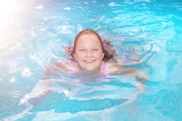 Fototapeta na wymiar swimming summer pool young Girl smiling