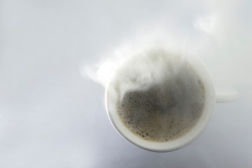 Top view Coffee, drinks in warm glass with smoke on a white back