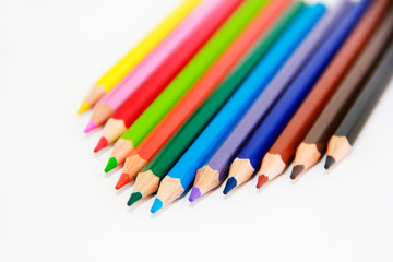 colorful wooden pencils for drawing on white background