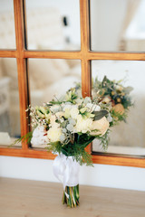 beautiful wedding bouquet of flowers on a light background