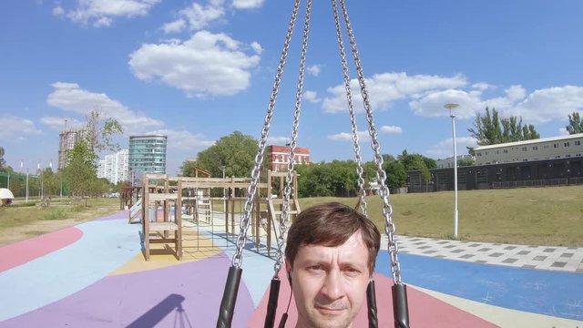 The man on the chain swing