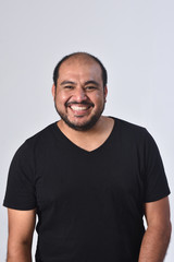 portrait of a smiling latin man on white