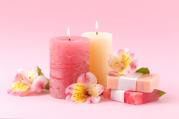 Obraz na płótnie Canvas Spa. Aromatherapy. Body care cosmetics. Handmade soap and candles on a gentle pink background