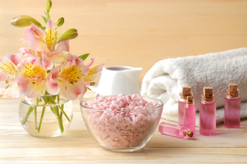 Spa. Aromatherapy. Body care cosmetics. and aroma oil sea salt on a natural wooden background.