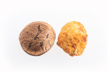 Dried seeds of sacha fruit - Inchi peanuts - Plukenetia volubilis. White background