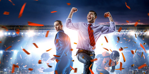 Business team on football stadium. Mixed media