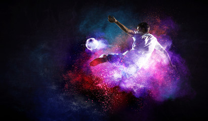 Obraz na płótnie Canvas Soccer player in action. Mixed media
