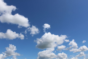 Blue sky with white fluffy big clouds