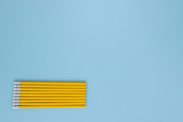 Writing pencils laid evenly toward one another