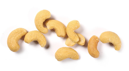 Salted cashew nuts isolated on white background, top view